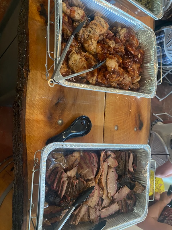 Catering spread of brisket and chicken